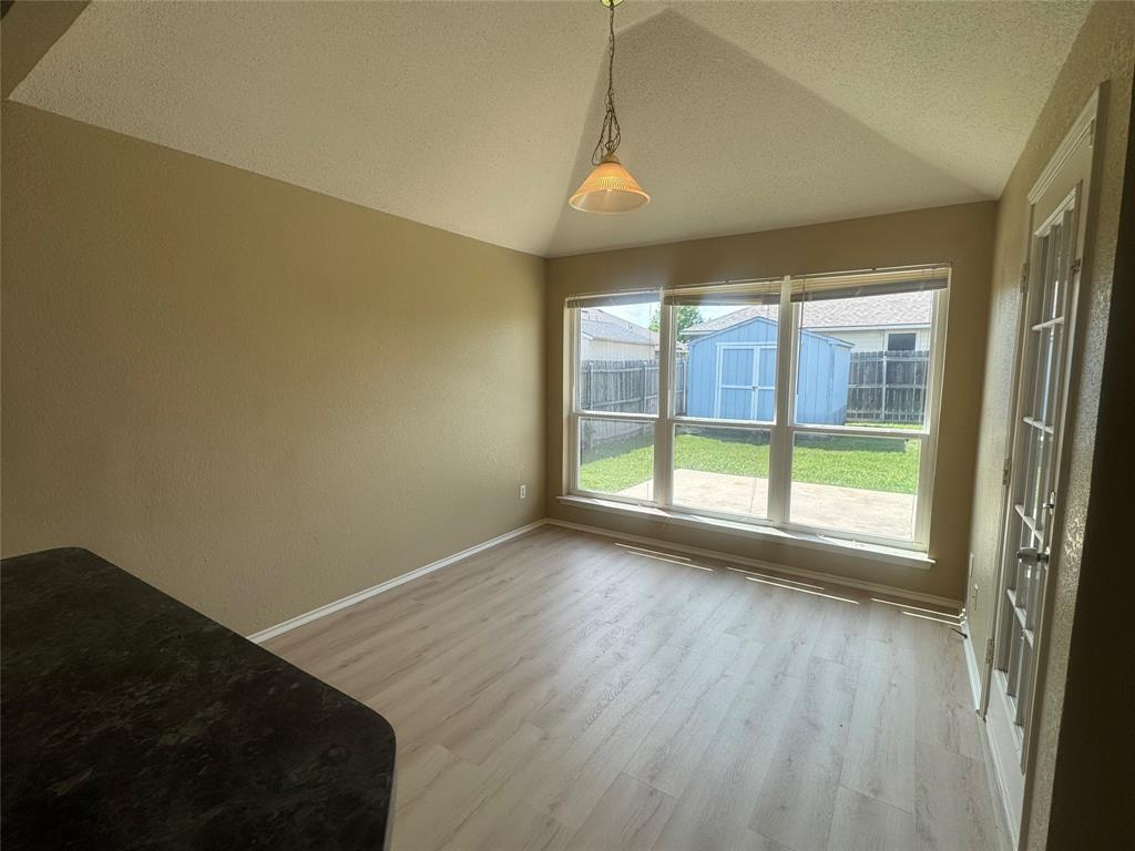 908 Cedar Ridge Lane Burleson, TX 76028 - Photo 5 of 24 an empty room with wooden floor and windows
