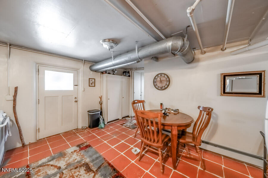 680 Edelweiss Street Reno, NV 89502 - Photo 18 of 29 a dining room with furniture and a clock