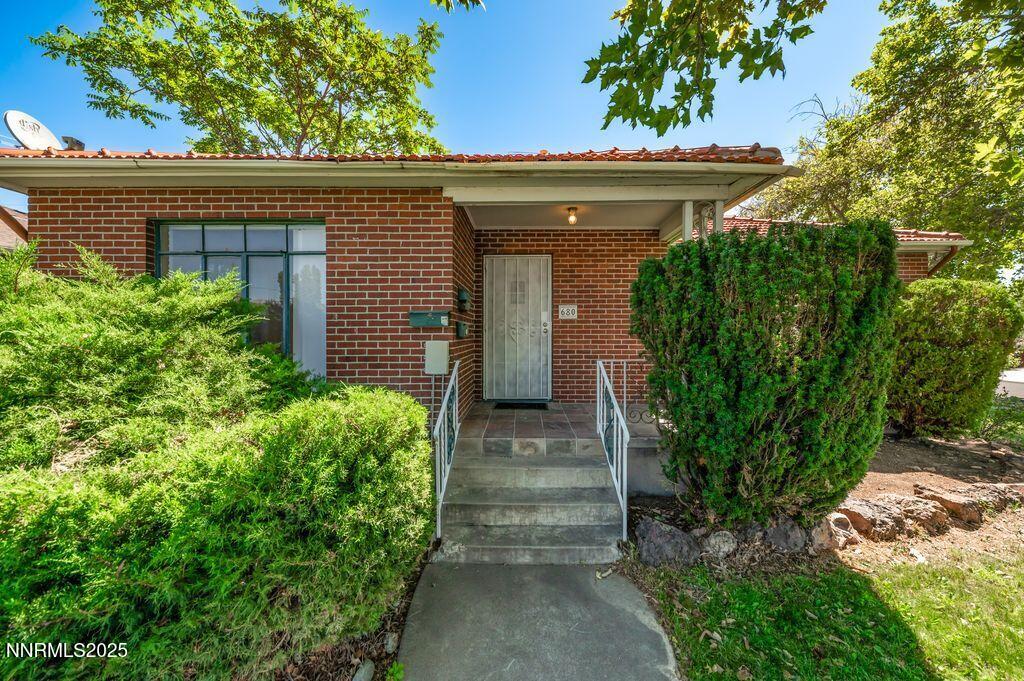 680 Edelweiss Street Reno, NV 89502 - Photo 3 of 29 a front view of a house with garden