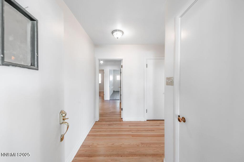 680 Edelweiss Street Reno, NV 89502 - Photo 4 of 29 a view of a hallway with wooden floor and staircase