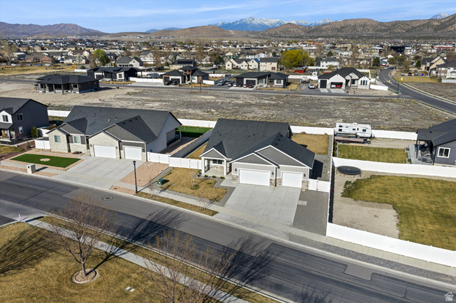3938 North Wood Road Eagle Mountain, UT 84005 - Photo 46 of 55 Aerial view of residential area with mountains