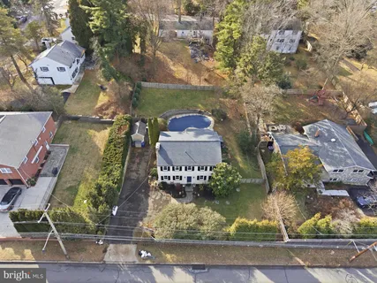 an aerial view of a residential houses with outdoor space