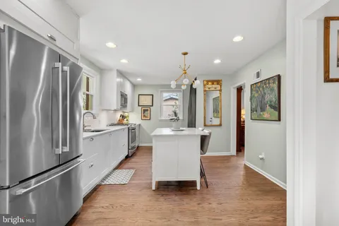 a kitchen with counter top space and refrigerator