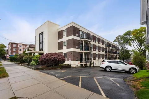 a view of a cars parked in front of a building