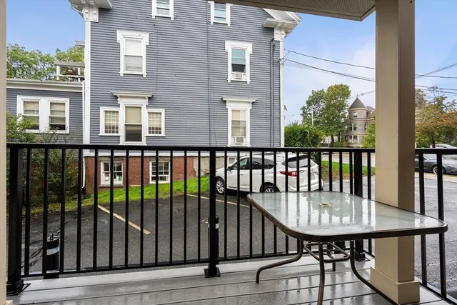 a view of a balcony with a wooden floor