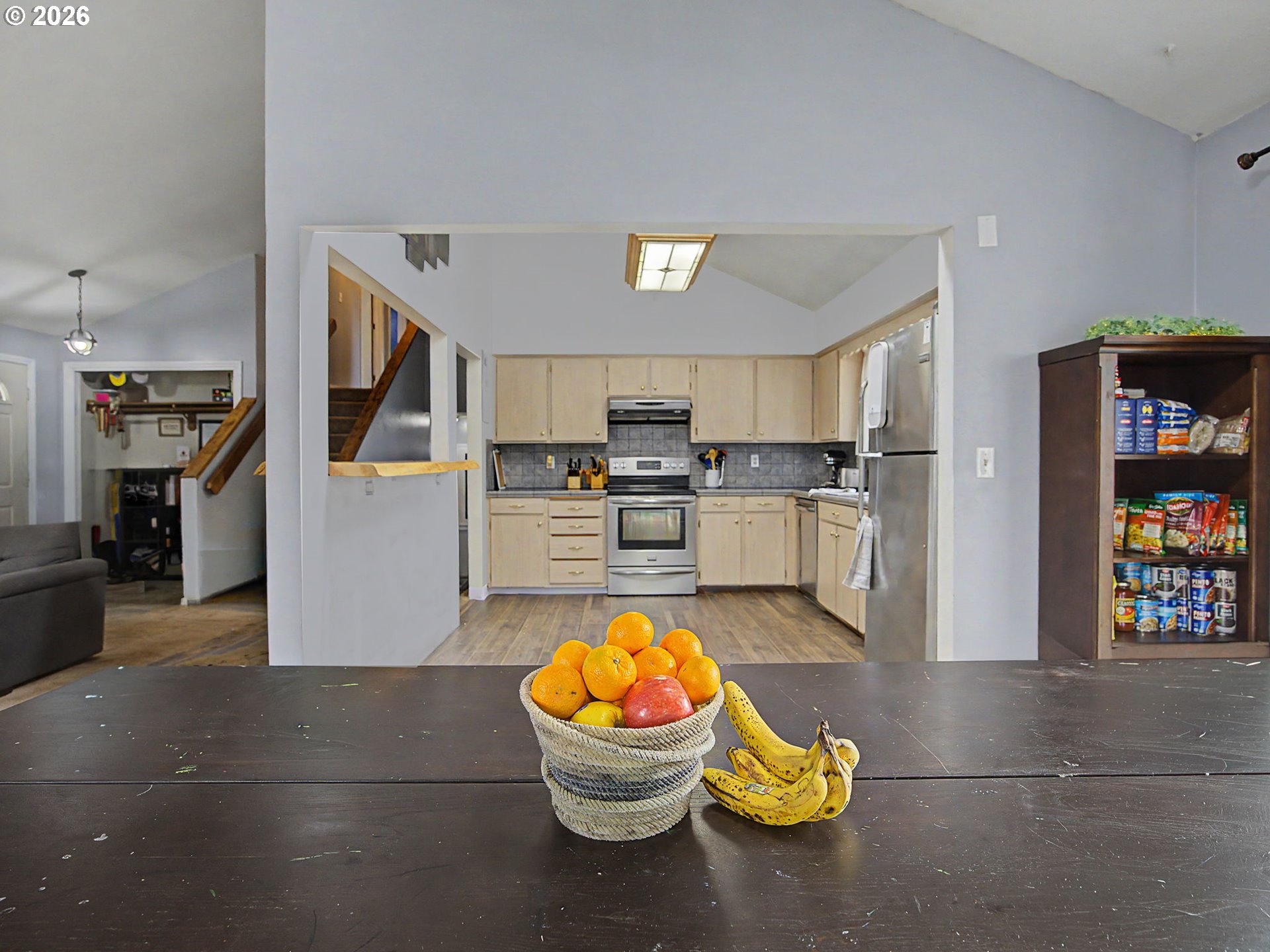 18015 Davis Street Sandy, OR 97055 - Photo 10 of 40 a kitchen with stainless steel appliances kitchen island granite countertop a refrigerator and a stove