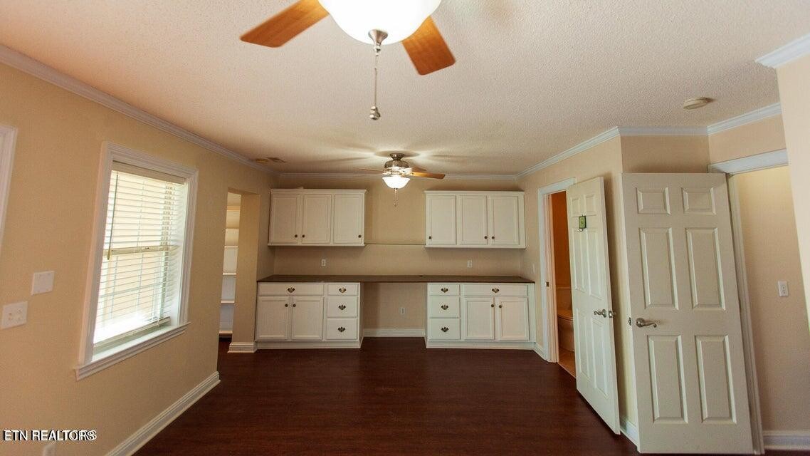 275 Hawthorn Loop Crossville, TN 38555 - Photo 19 of 59 a kitchen with granite countertop a sink a window and stainless steel appliances