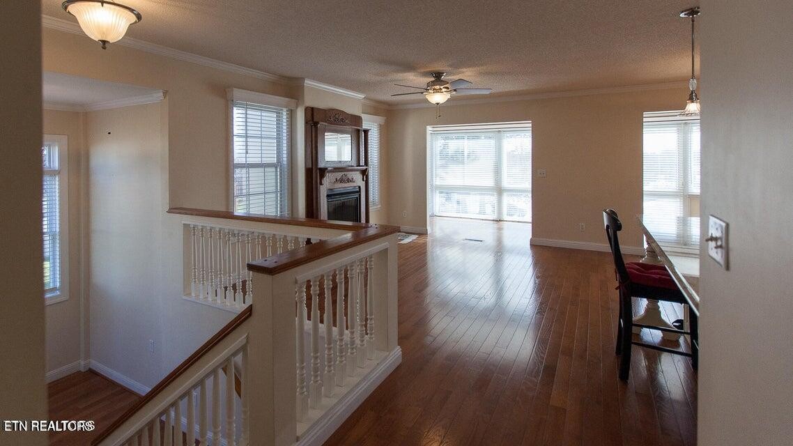 275 Hawthorn Loop Crossville, TN 38555 - Photo 30 of 59 a view of a livingroom with wooden floor and stairs