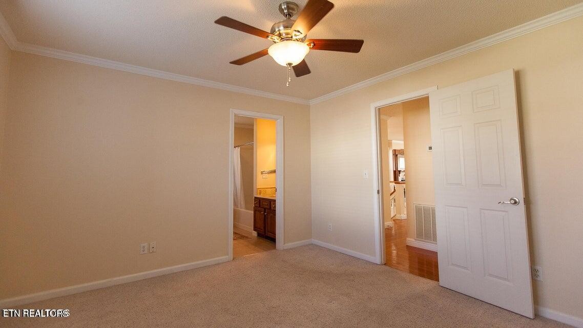 275 Hawthorn Loop Crossville, TN 38555 - Photo 35 of 59 an empty room with closet and a ceiling fan