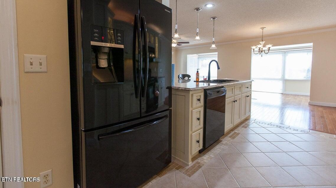 275 Hawthorn Loop Crossville, TN 38555 - Photo 39 of 59 a kitchen with stainless steel appliances granite countertop a refrigerator and a sink