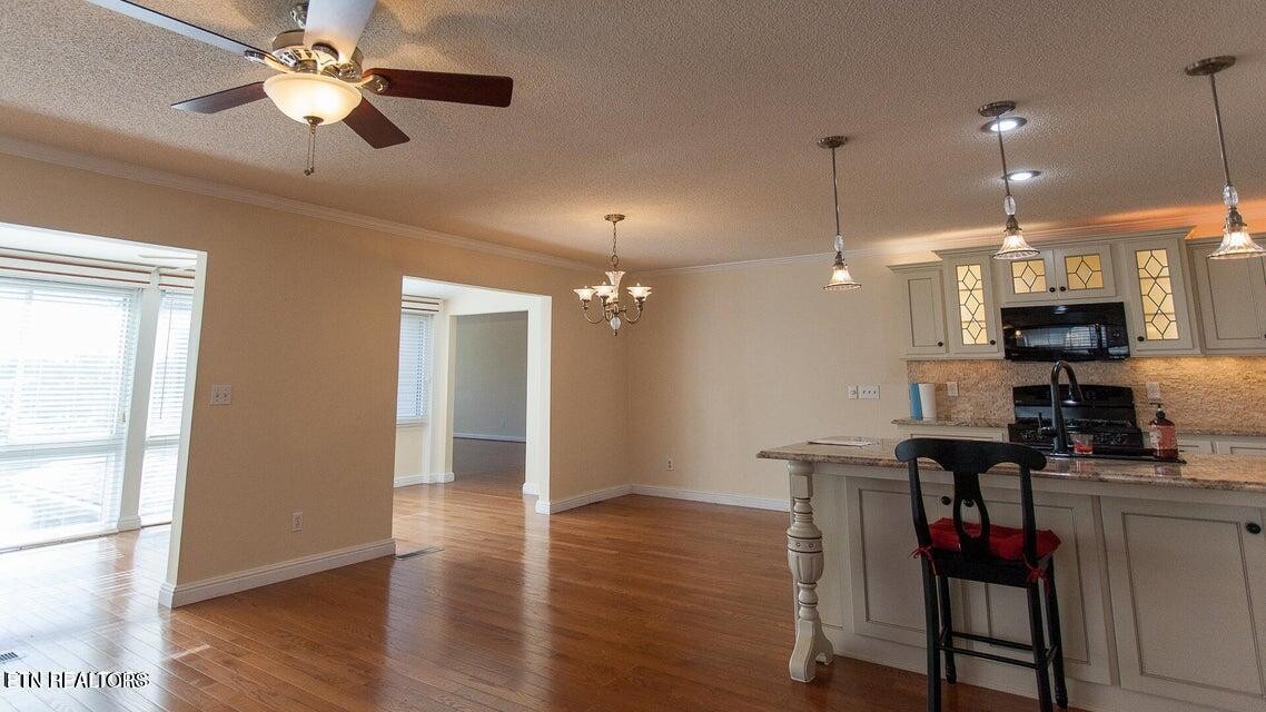 275 Hawthorn Loop Crossville, TN 38555 - Photo 42 of 59 a view of a dining room with furniture and wooden floor