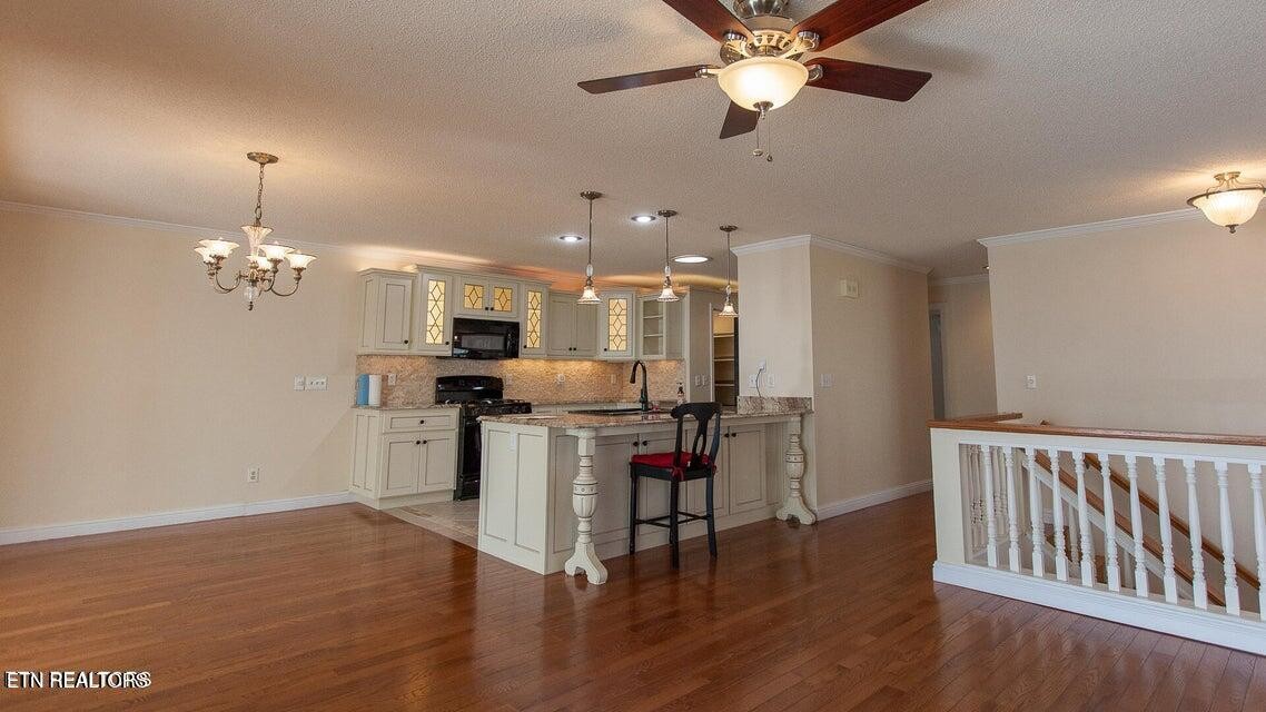 275 Hawthorn Loop Crossville, TN 38555 - Photo 43 of 59 a view of kitchen with furniture and wooden floor