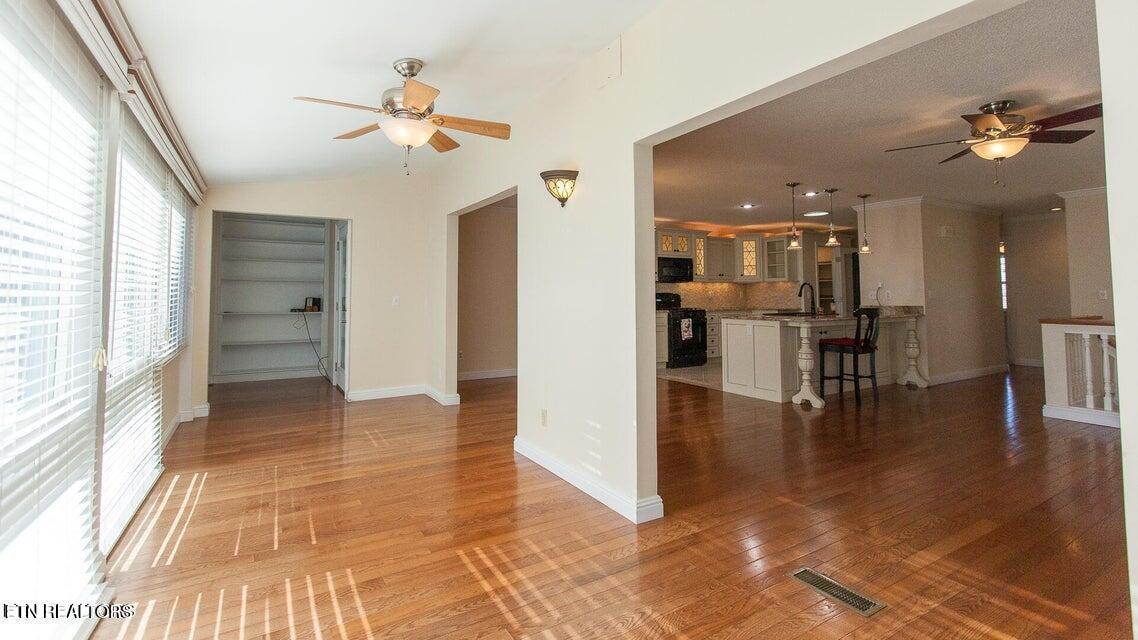 275 Hawthorn Loop Crossville, TN 38555 - Photo 44 of 59 a view of a livingroom with a furniture wooden floor and a large window