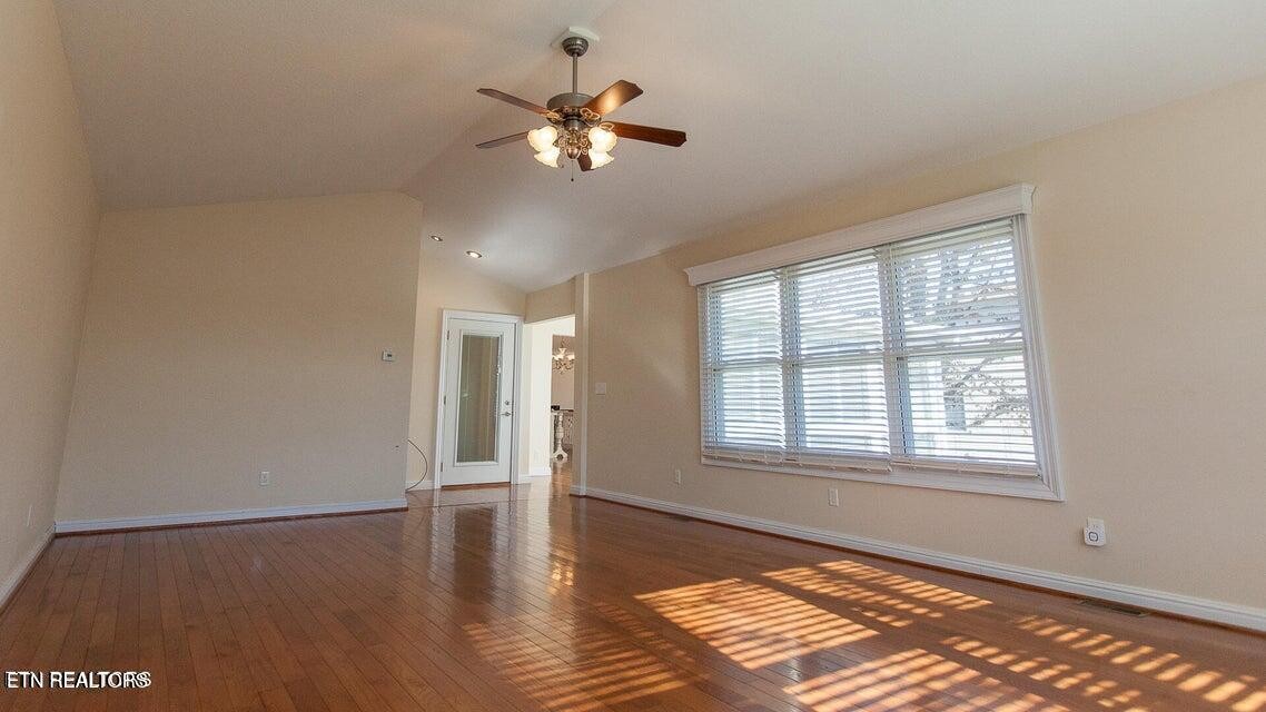 275 Hawthorn Loop Crossville, TN 38555 - Photo 48 of 59 a view of an empty room with wooden floor and a window