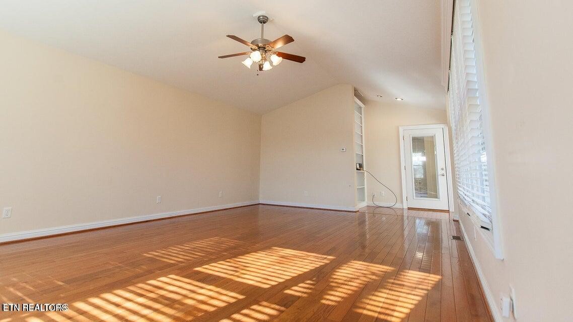 275 Hawthorn Loop Crossville, TN 38555 - Photo 49 of 59 wooden floor in an empty room with a window