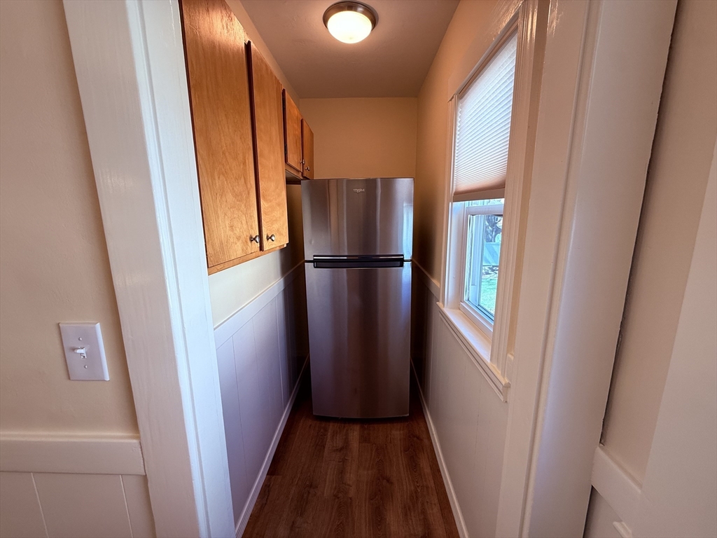 15 Chauncey Street, Unit 2 Watertown, MA 02472 - Photo 8 of 16 a view of kitchen with furniture and refrigerator