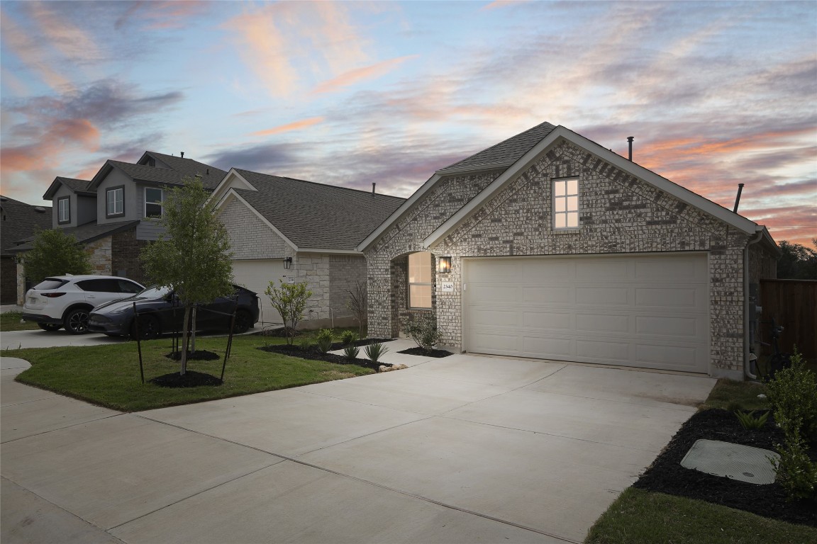 2340 Sawdust Drive Georgetown, TX 78633 - Photo 1 of 40 a front view of a house with garden