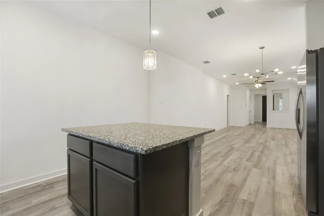 an empty room with wooden floor