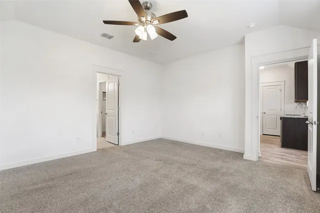 an empty room with a bathroom