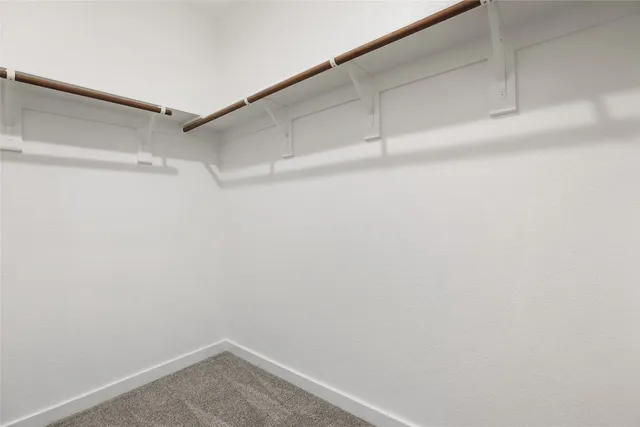 a view of a room with shelf on the wall