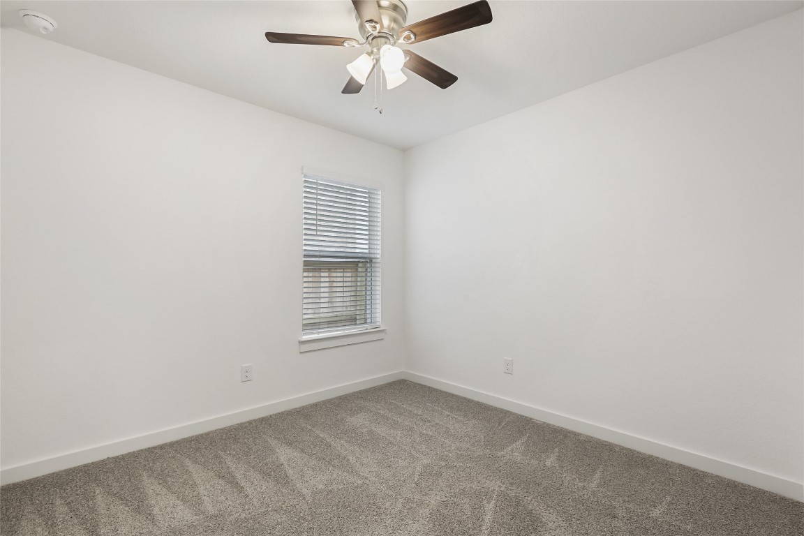 2340 Sawdust Drive Georgetown, TX 78633 - Photo 26 of 40 an empty room with a window and a fan
