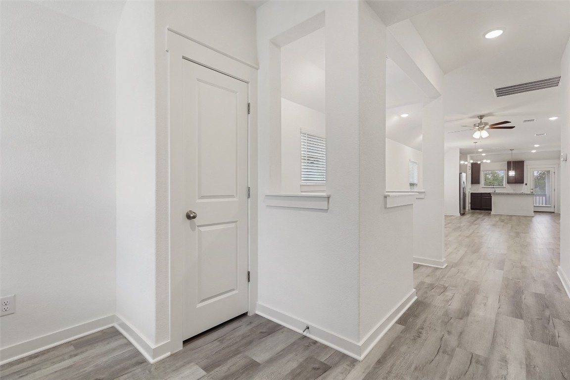 2340 Sawdust Drive Georgetown, TX 78633 - Photo 6 of 40 a view of a hallway with wooden floor