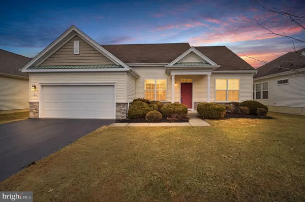a front view of a house with yard