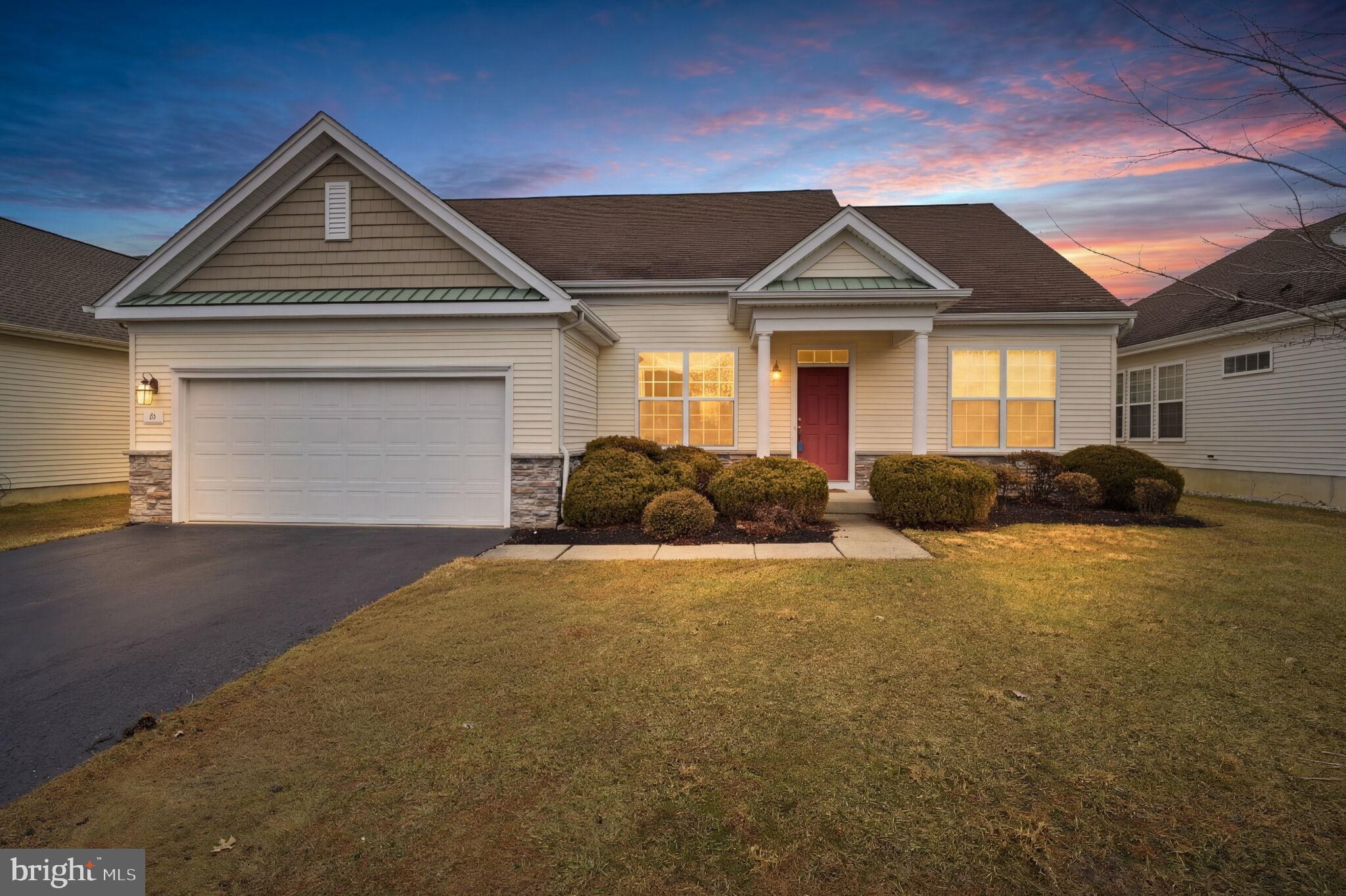 a front view of a house with yard