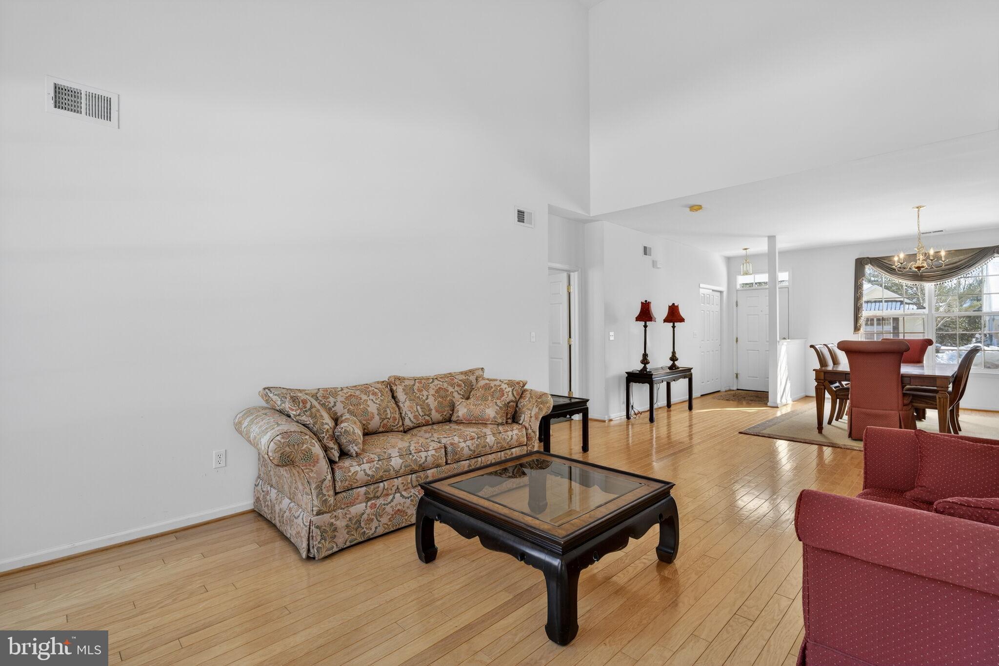 76 Portland Street Barnegat, NJ 08005 - Photo 16 of 47 a living room with furniture and a wooden floor