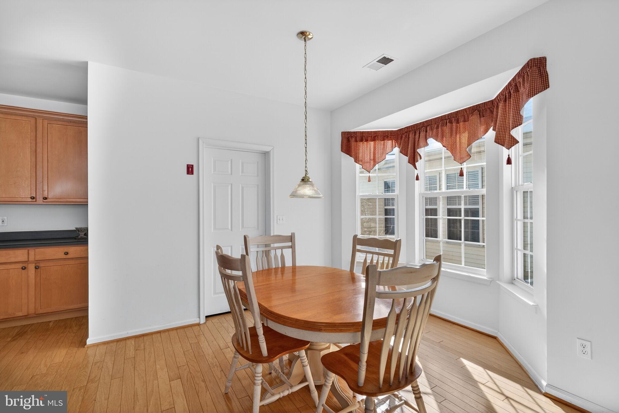 76 Portland Street Barnegat, NJ 08005 - Photo 22 of 47 a view of a dining room with furniture window and wooden floor