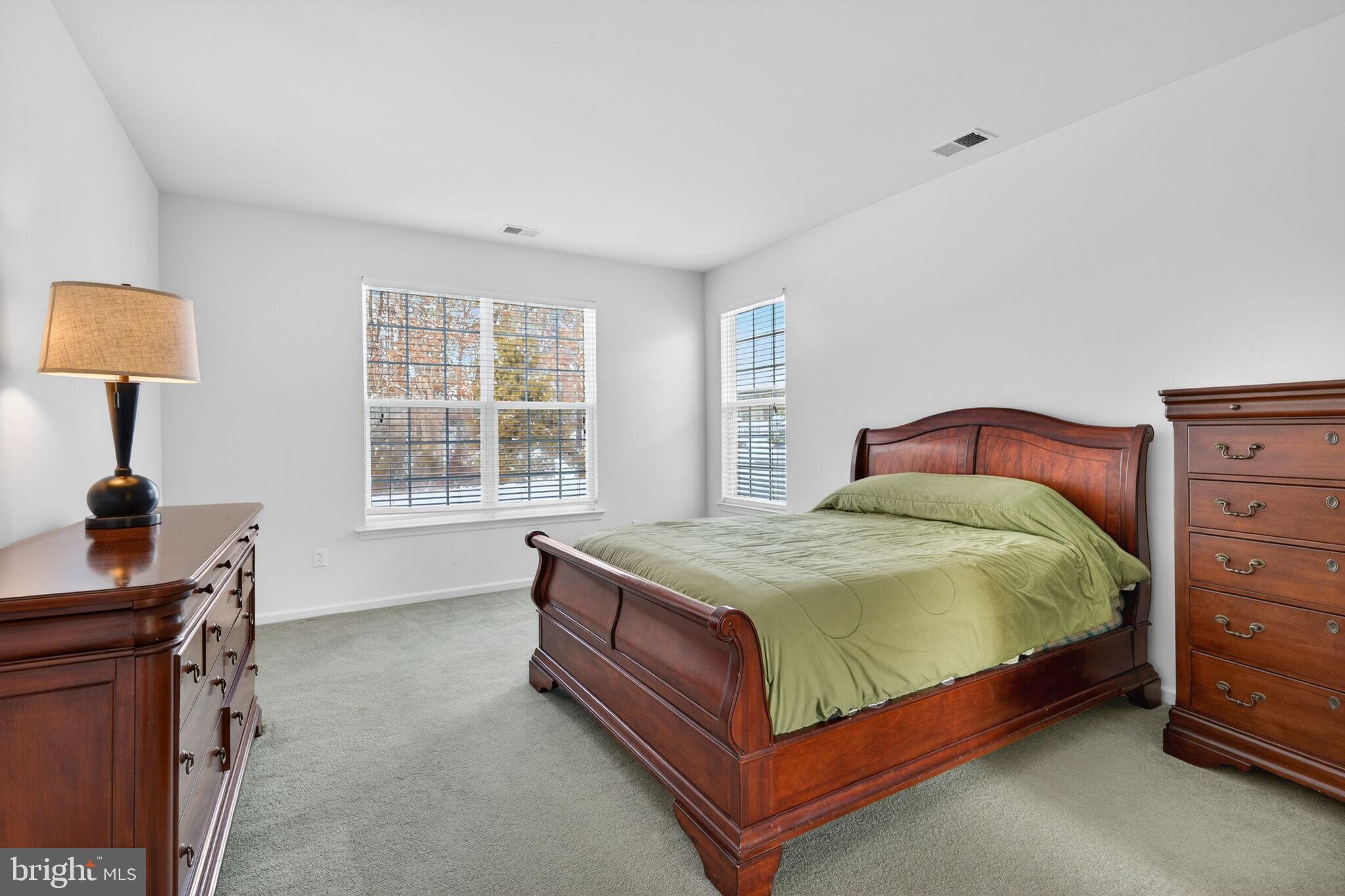 76 Portland Street Barnegat, NJ 08005 - Photo 29 of 47 a bed sitting in a bedroom next to a window
