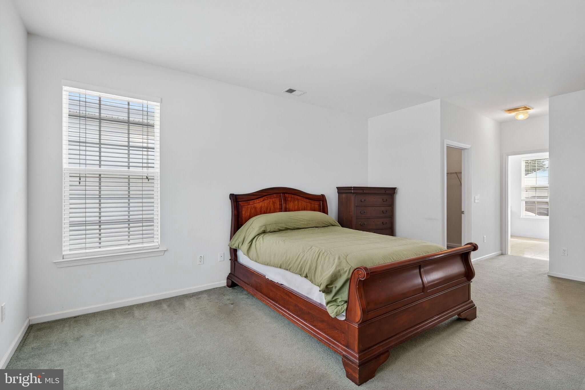 76 Portland Street Barnegat, NJ 08005 - Photo 32 of 47 a large bed sitting in a bedroom next to a window