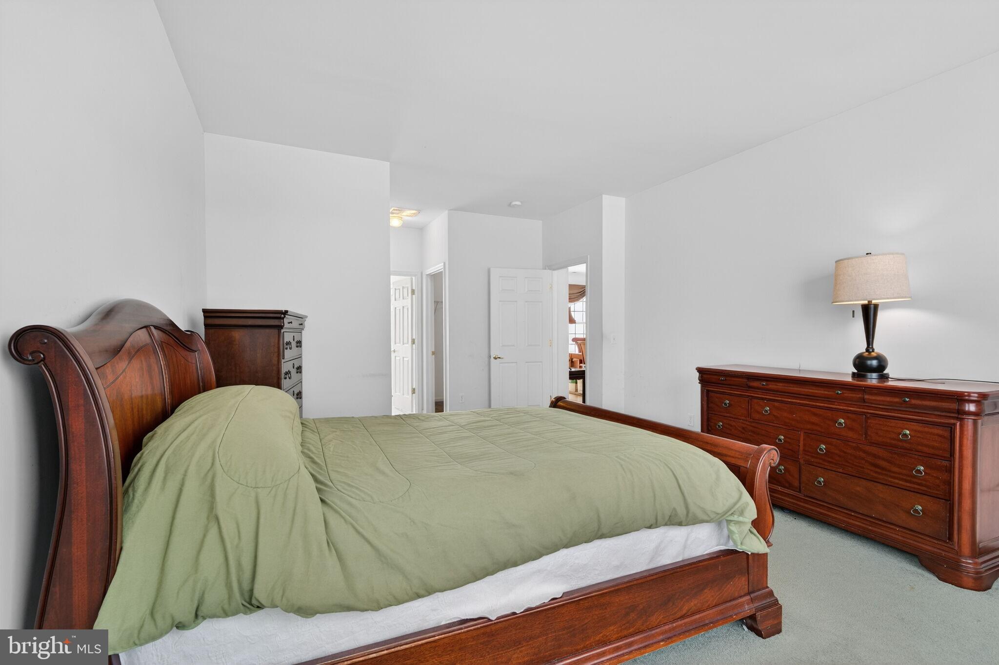 76 Portland Street Barnegat, NJ 08005 - Photo 33 of 47 a bedroom with a bed and wooden floor