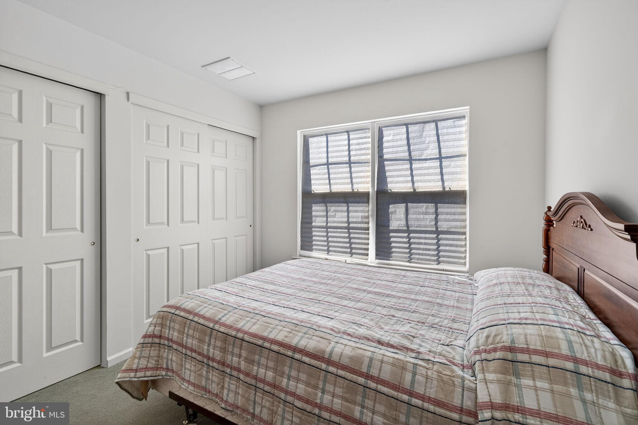 76 Portland Street Barnegat, NJ 08005 - Photo 46 of 47 a bedroom with a bed and a window