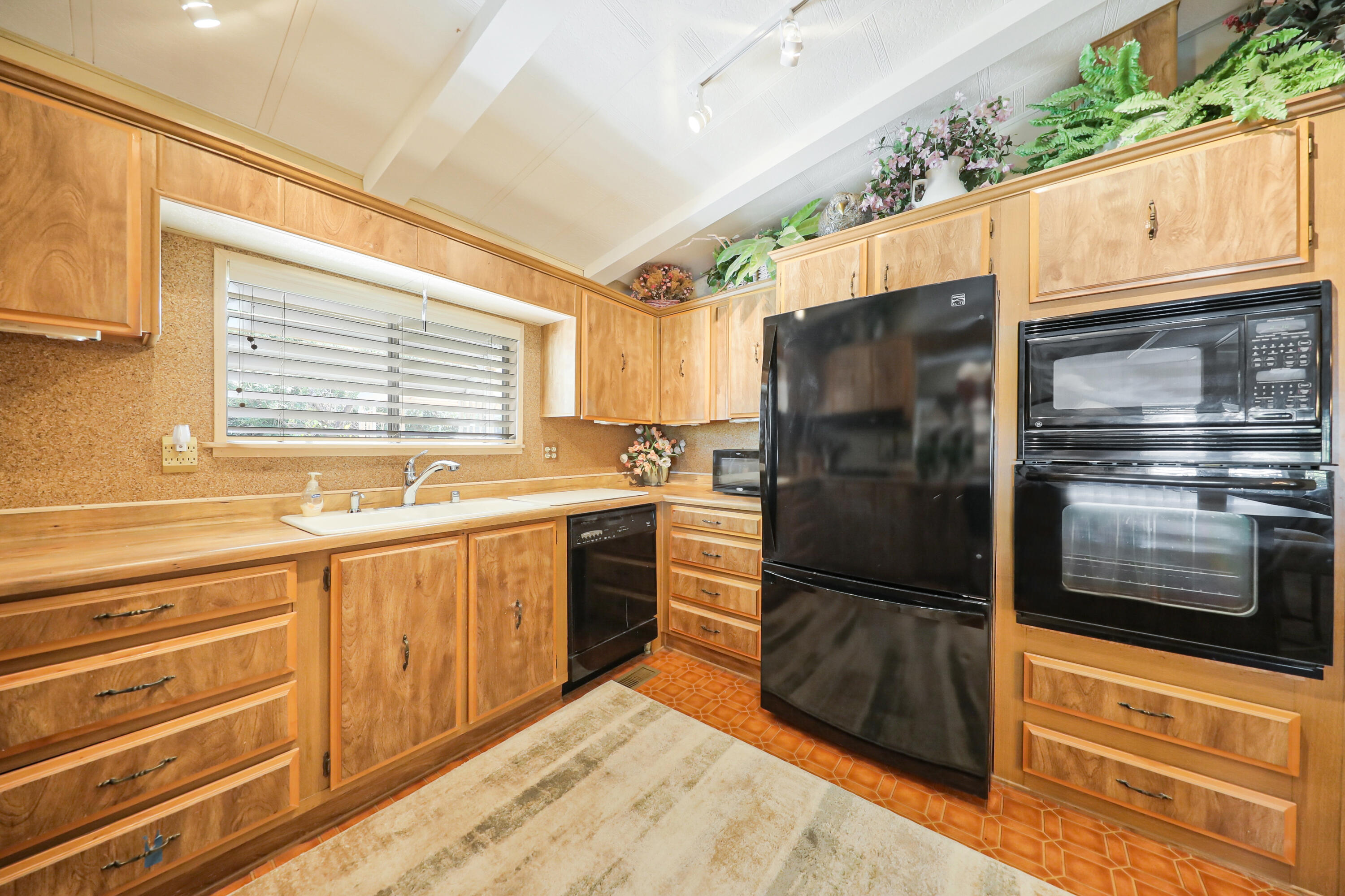 49305 Highway 74, Unit 86 Palm Desert, CA 92260 - Photo 12 of 31 a kitchen with granite countertop stainless steel appliances and counter space