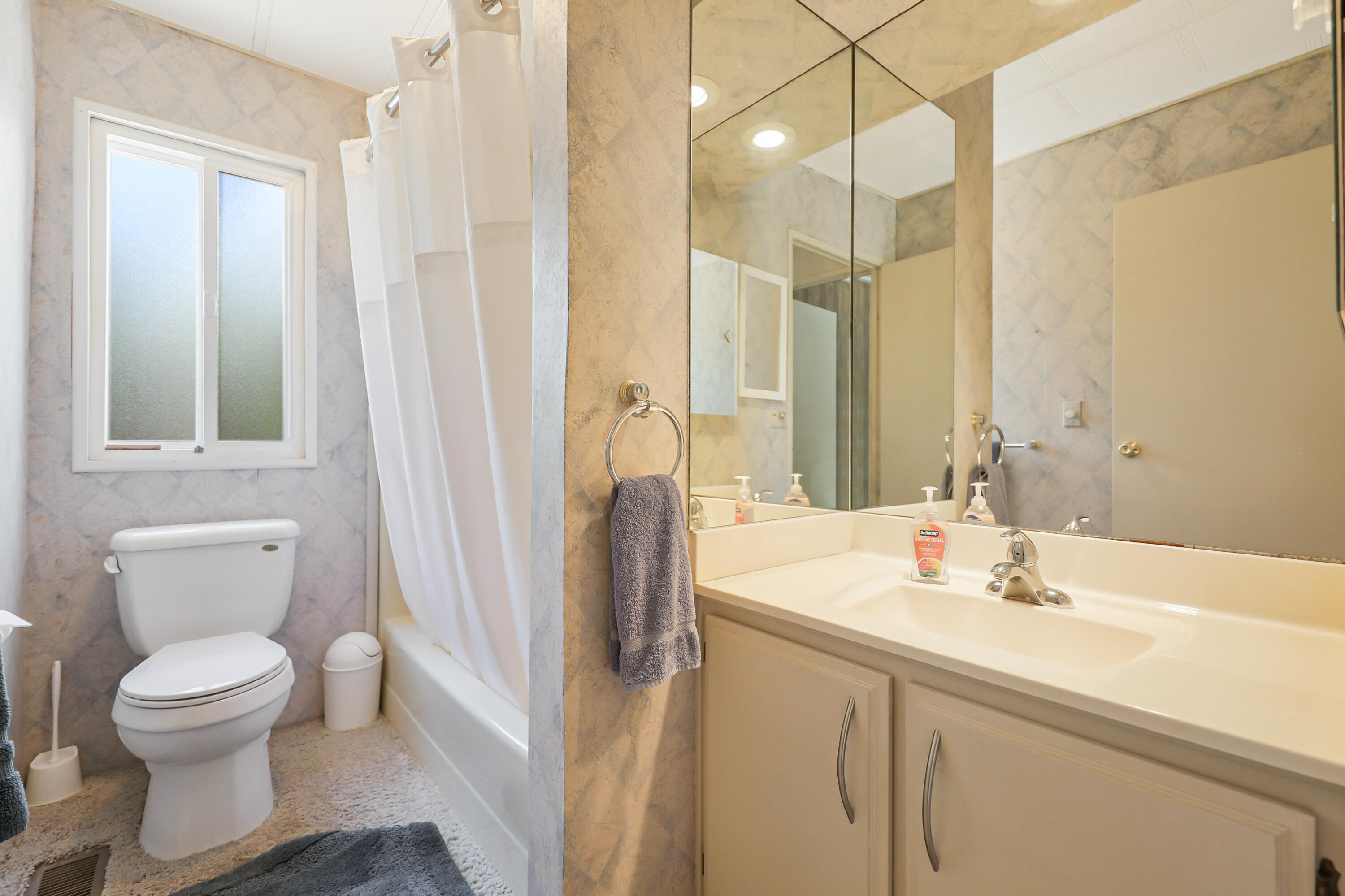 49305 Highway 74, Unit 86 Palm Desert, CA 92260 - Photo 22 of 31 a bathroom with a sink toilet and shower
