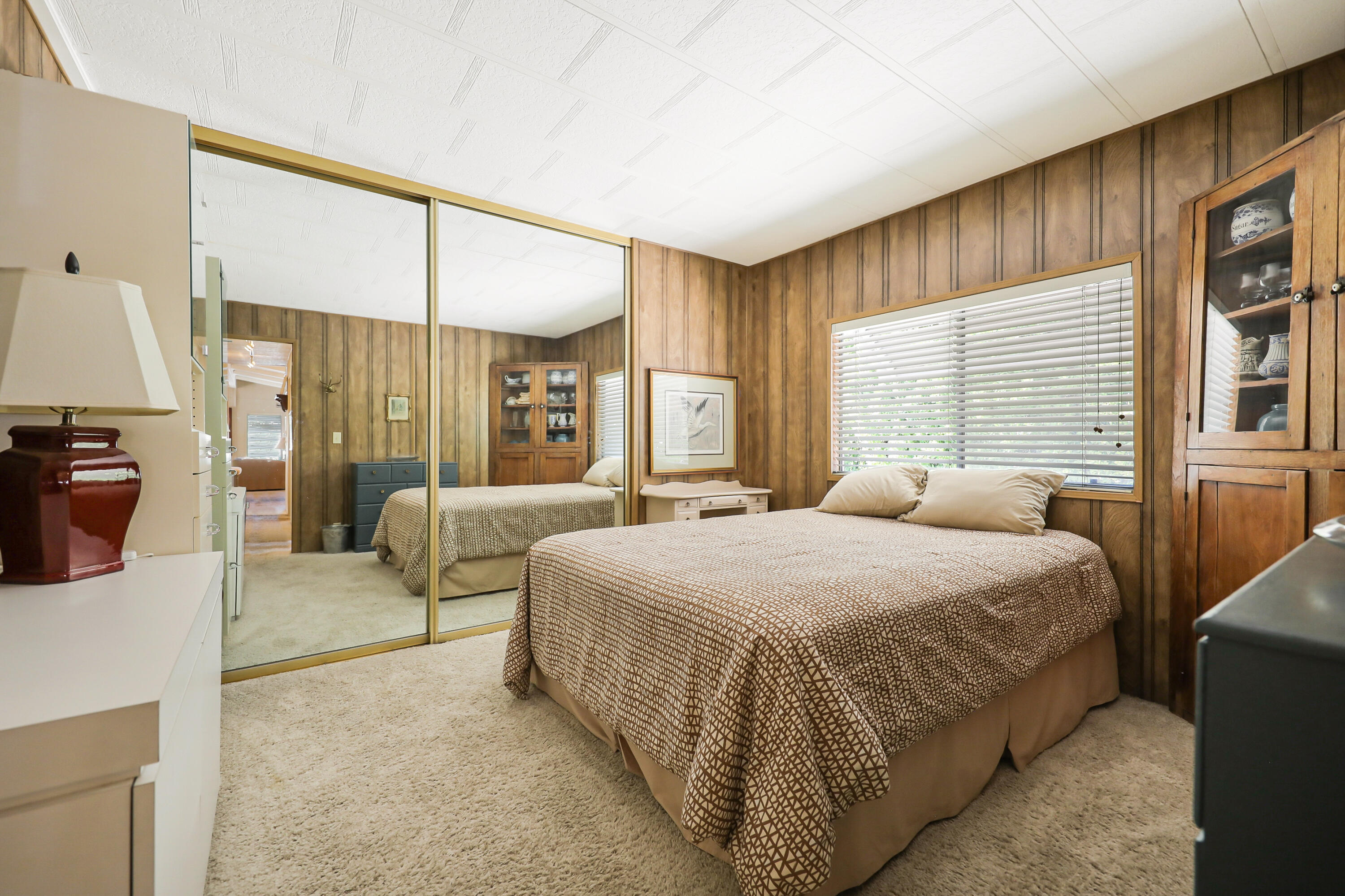 49305 Highway 74, Unit 86 Palm Desert, CA 92260 - Photo 23 of 31 a bedroom with a bed and a couch