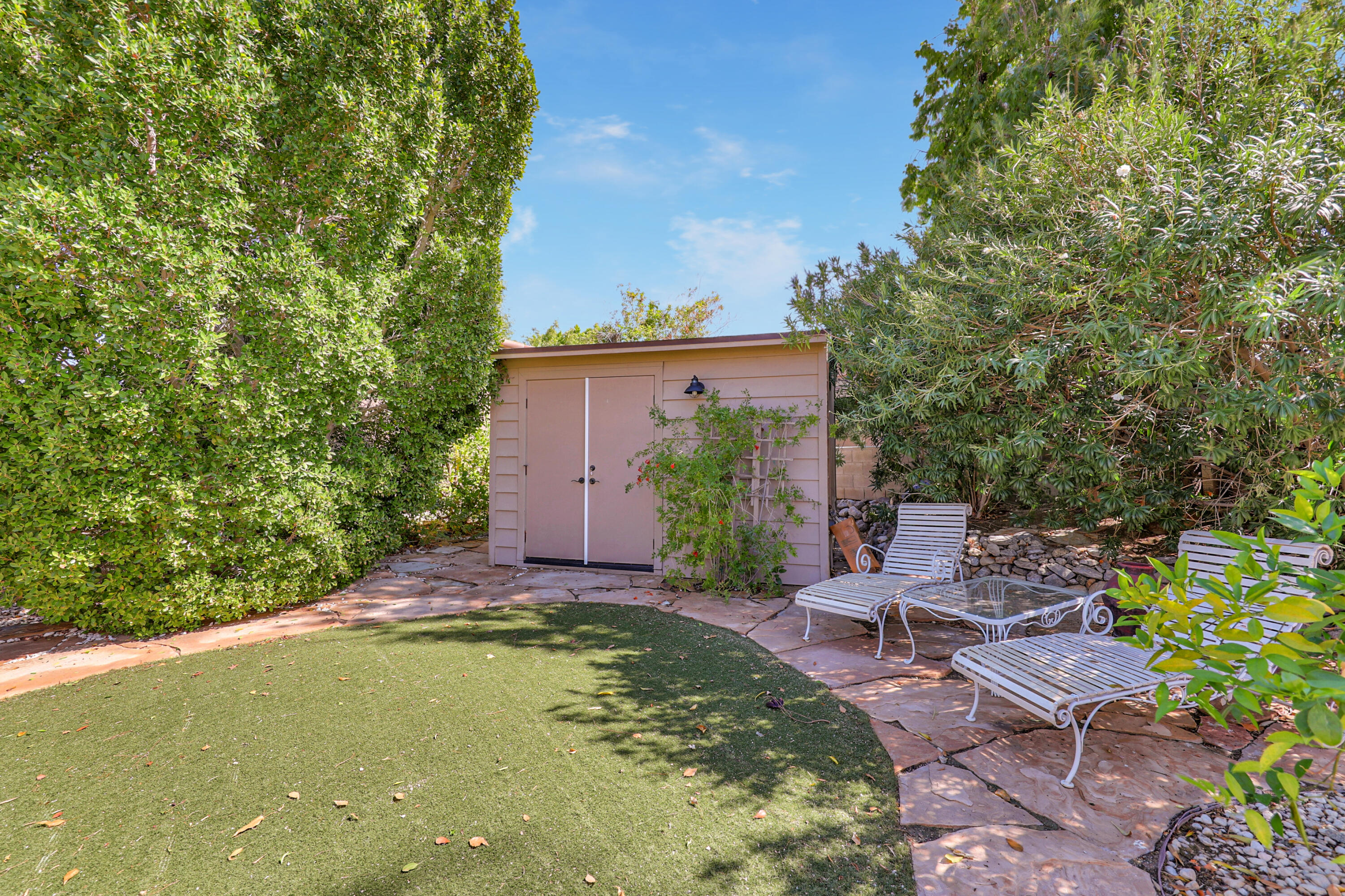49305 Highway 74, Unit 86 Palm Desert, CA 92260 - Photo 5 of 31 a view of backyard with swimming pool and outdoor seating