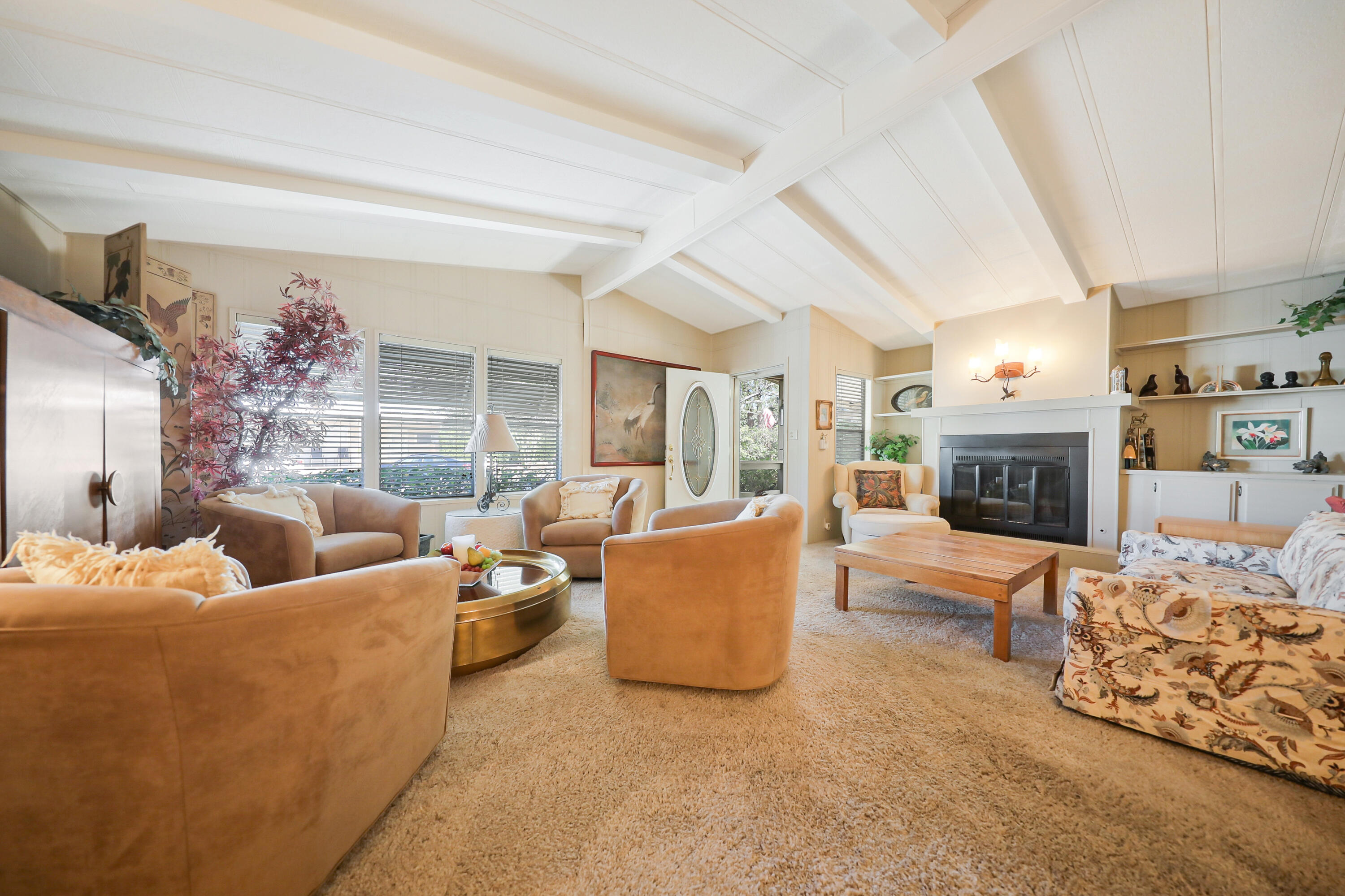 49305 Highway 74, Unit 86 Palm Desert, CA 92260 - Photo 8 of 31 a living room with furniture and a fireplace