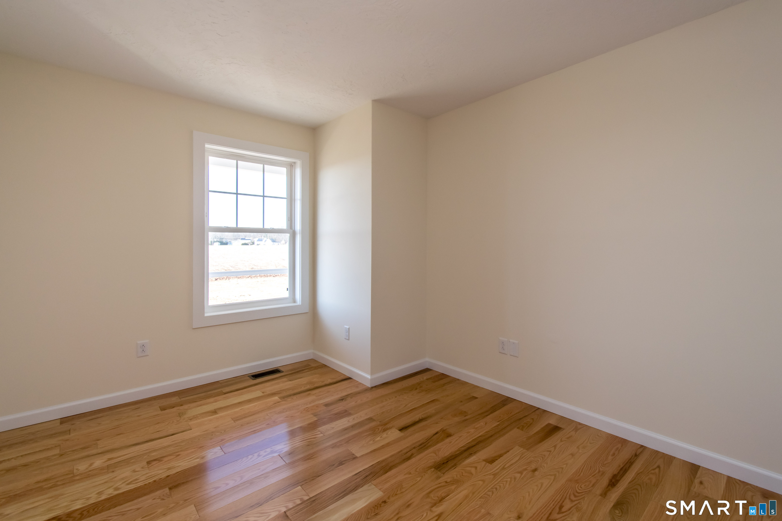 318 Capen Street Windsor, CT 06095 - Photo 19 of 30 an empty room with wooden floor and window