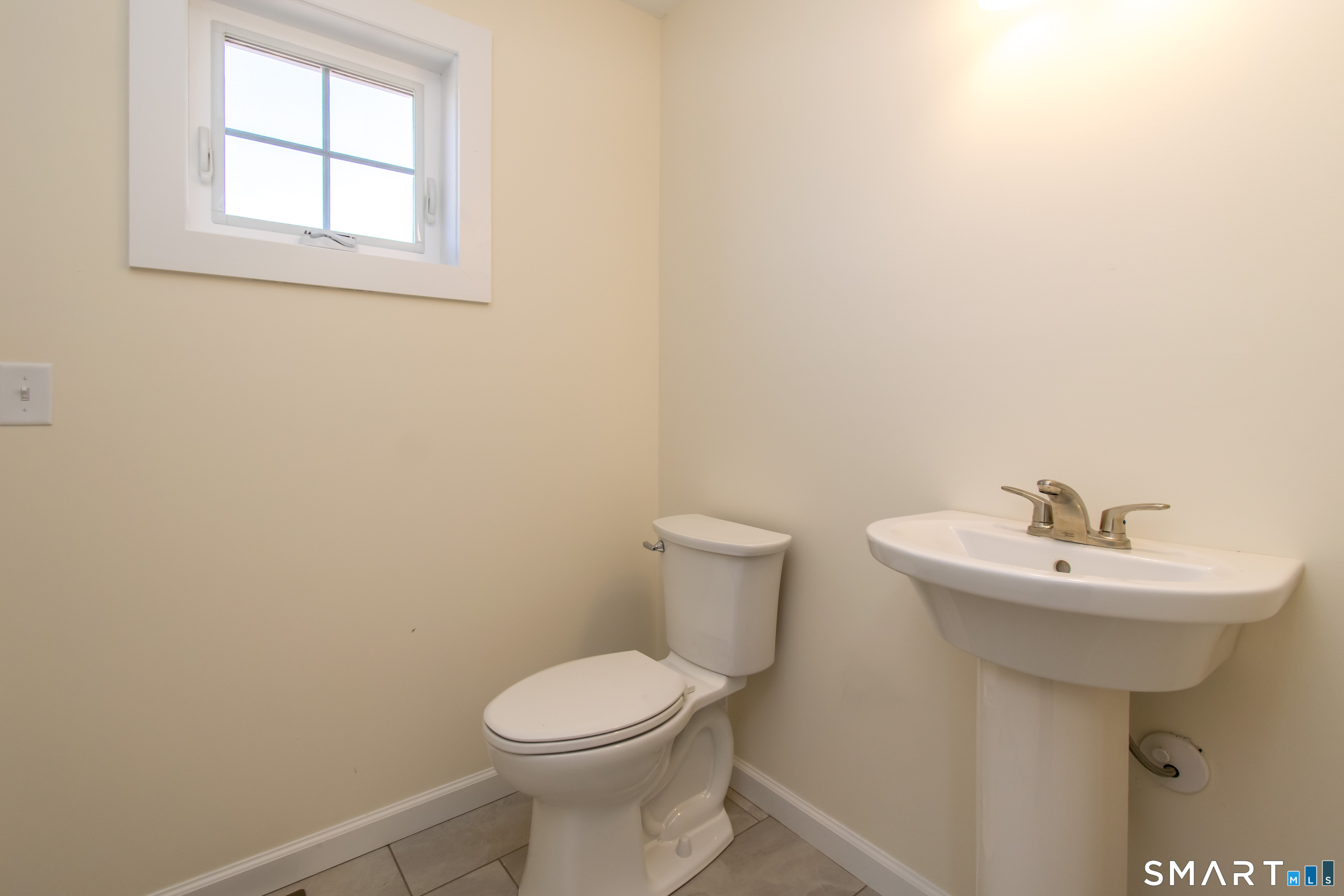318 Capen Street Windsor, CT 06095 - Photo 21 of 30 a bathroom with a sink a toilet and mirror