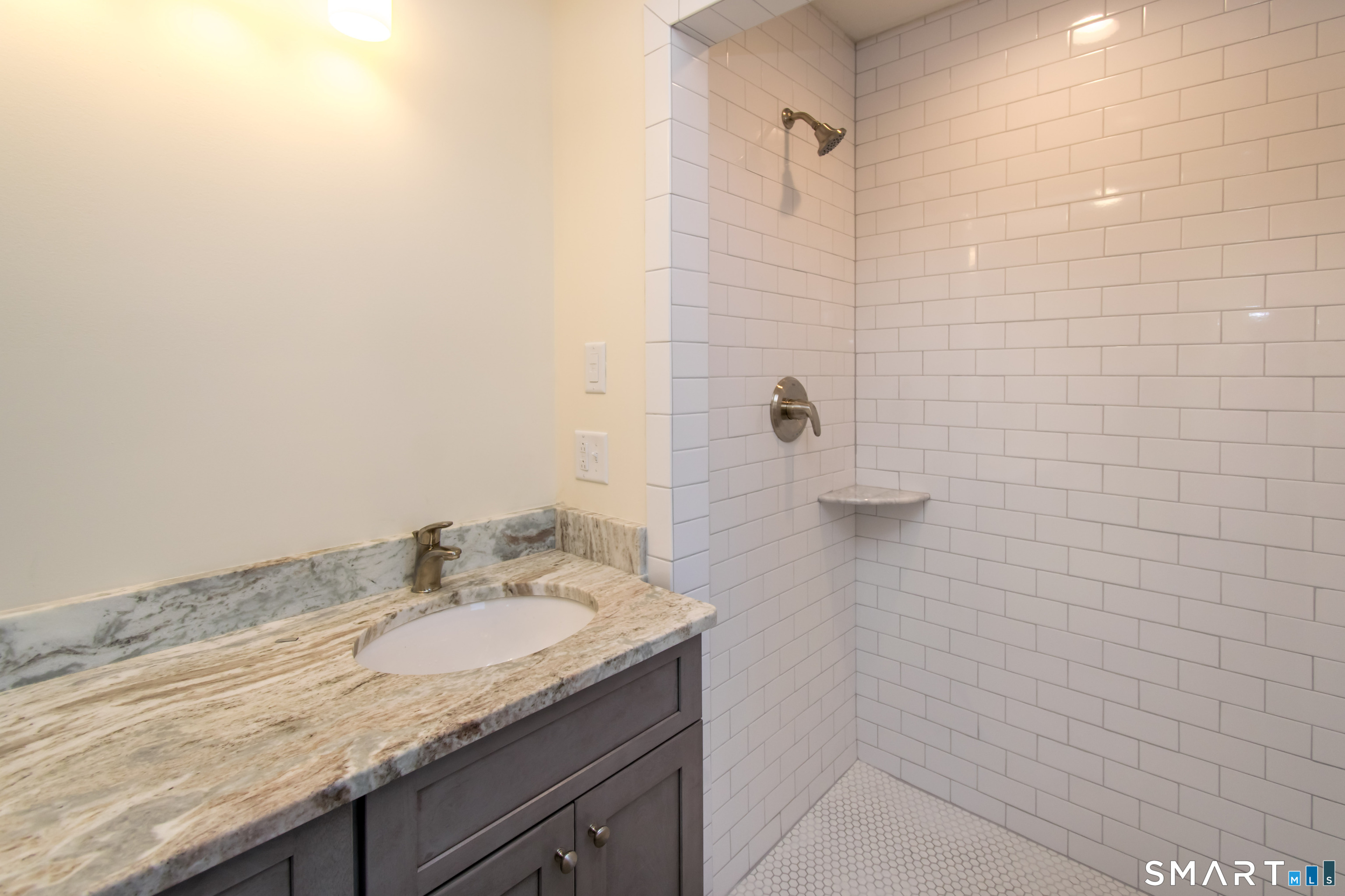 318 Capen Street Windsor, CT 06095 - Photo 26 of 30 a bathroom with a granite countertop sink and mirror
