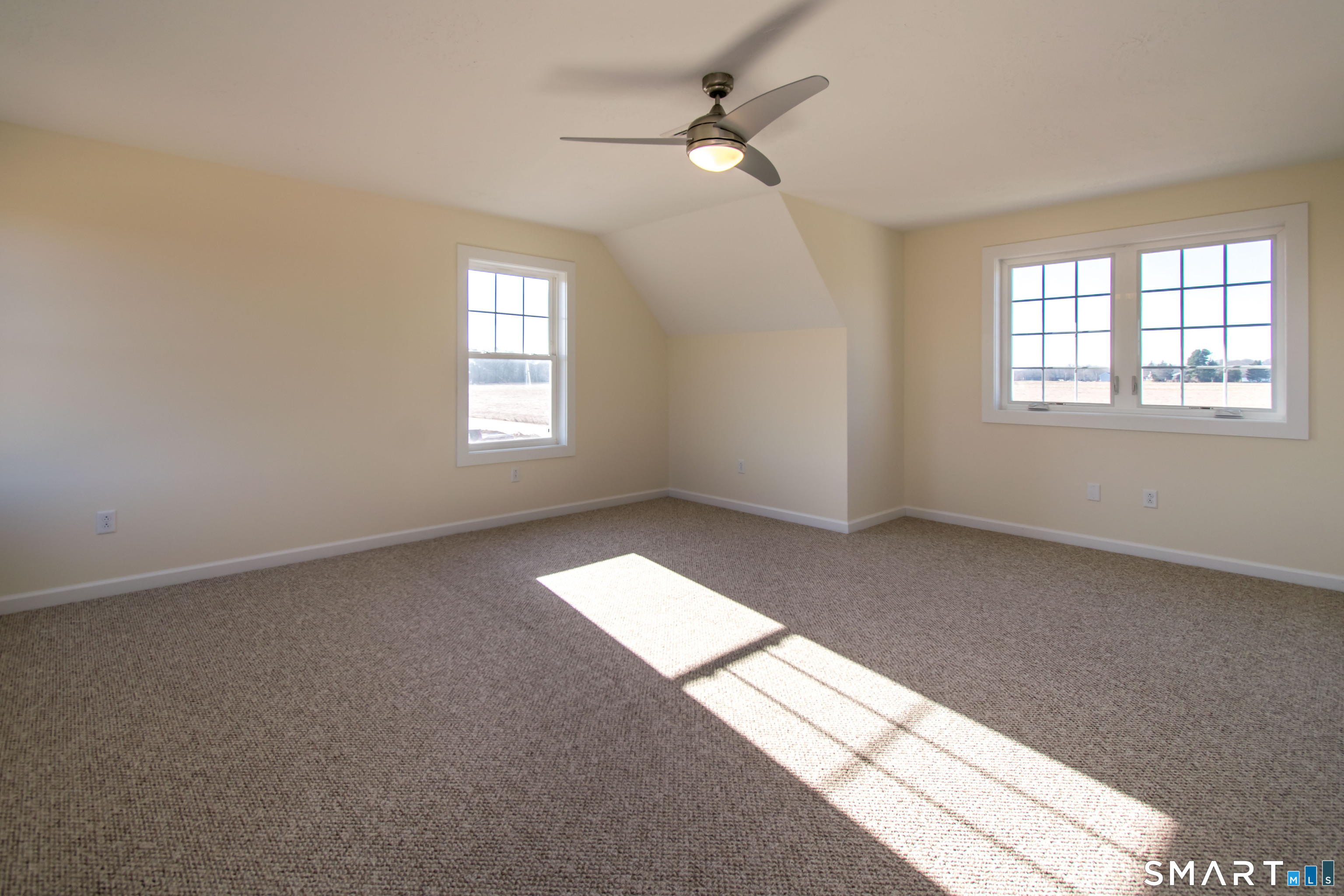 318 Capen Street Windsor, CT 06095 - Photo 27 of 30 an empty room with windows and ceiling fan