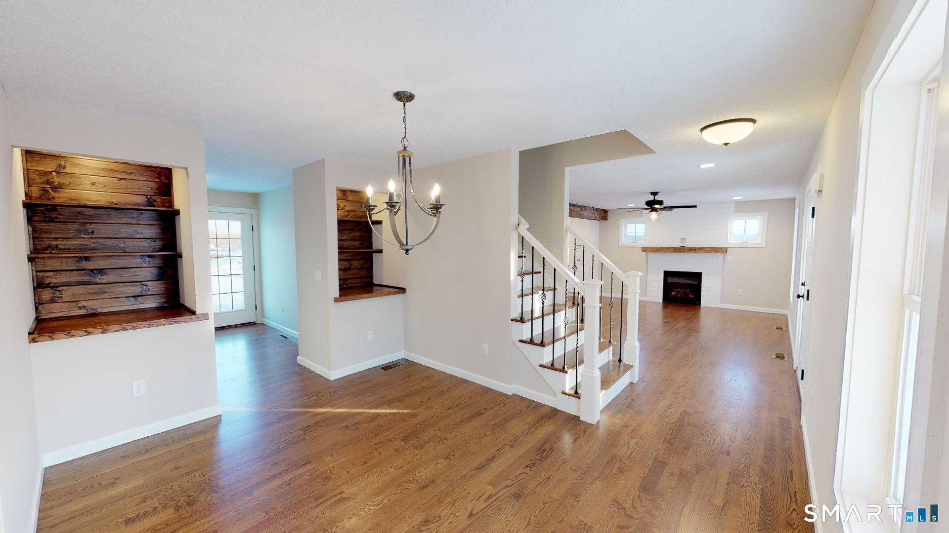 318 Capen Street Windsor, CT 06095 - Photo 8 of 30 a view of a hallway view with wooden floor and staircase