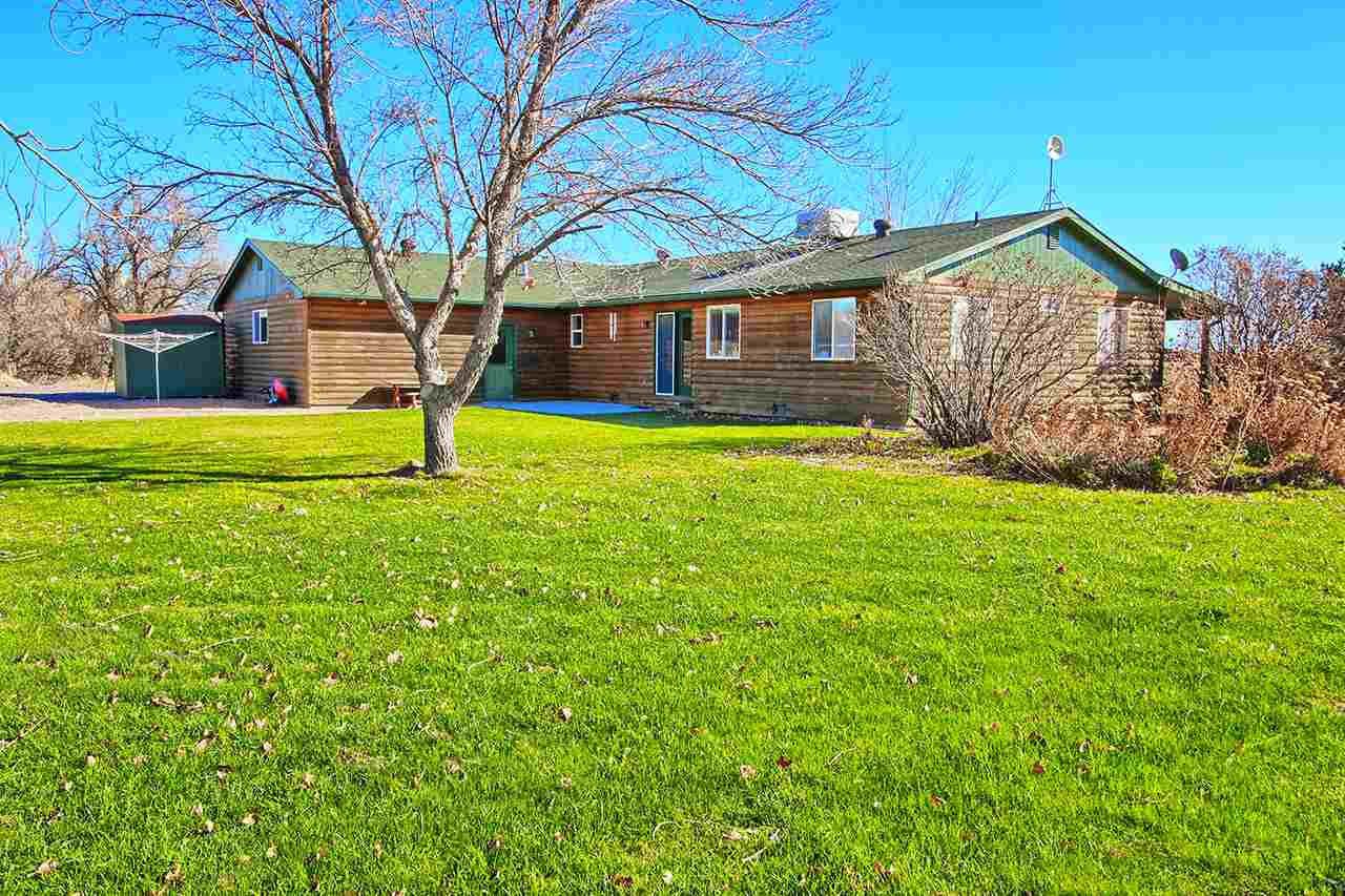1515 19 Road Fruita, CO 81521 - Photo 13 of 42 a brick house with garden view