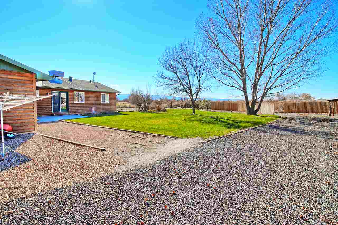 1515 19 Road Fruita, CO 81521 - Photo 16 of 42 a view of a house with a yard and pathway