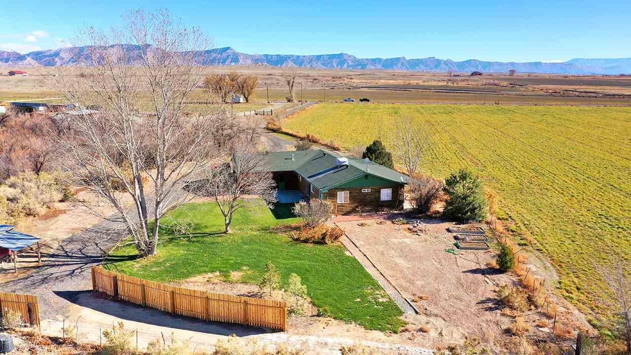 1515 19 Road Fruita, CO 81521 - Photo 20 of 42 a view of a house with a yard and sitting area
