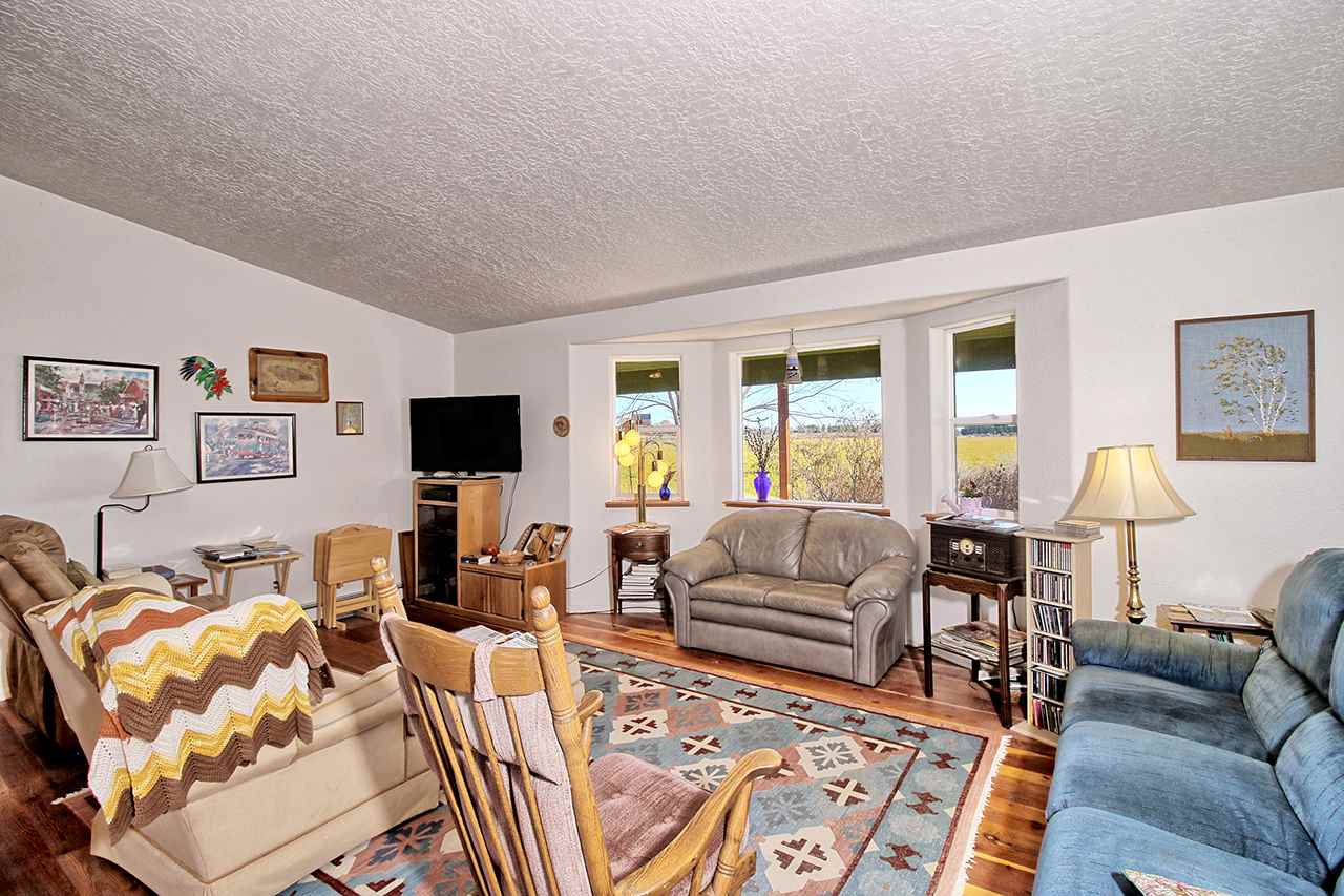 1515 19 Road Fruita, CO 81521 - Photo 25 of 42 a living room with furniture and a flat screen tv
