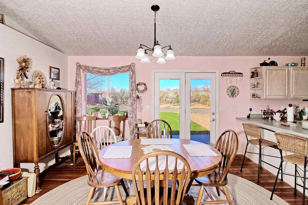 1515 19 Road Fruita, CO 81521 - Photo 31 of 42 a view of a dining room with furniture window and outside view