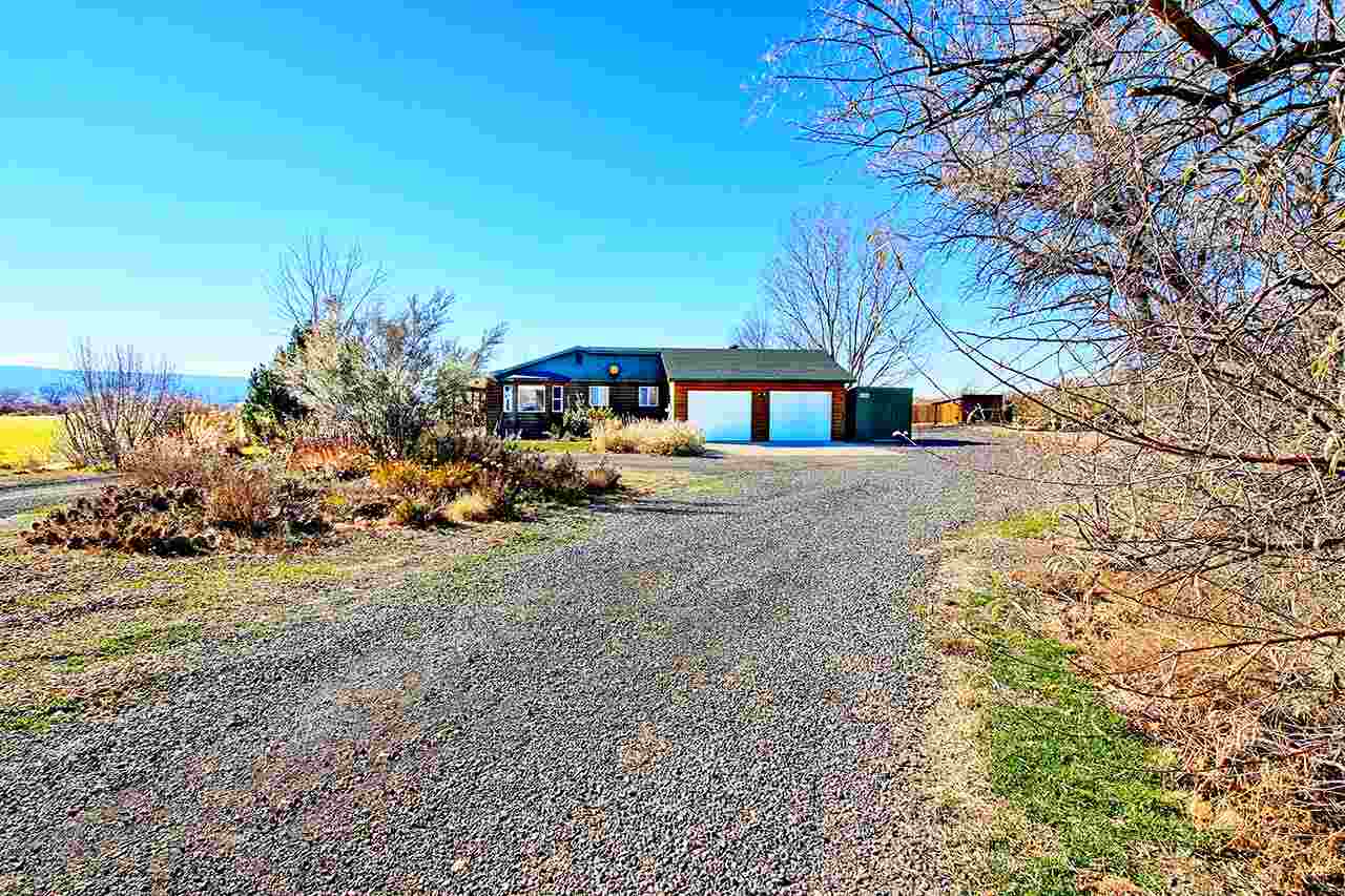 1515 19 Road Fruita, CO 81521 - Photo 5 of 42 a view of a house with a yard and sitting area